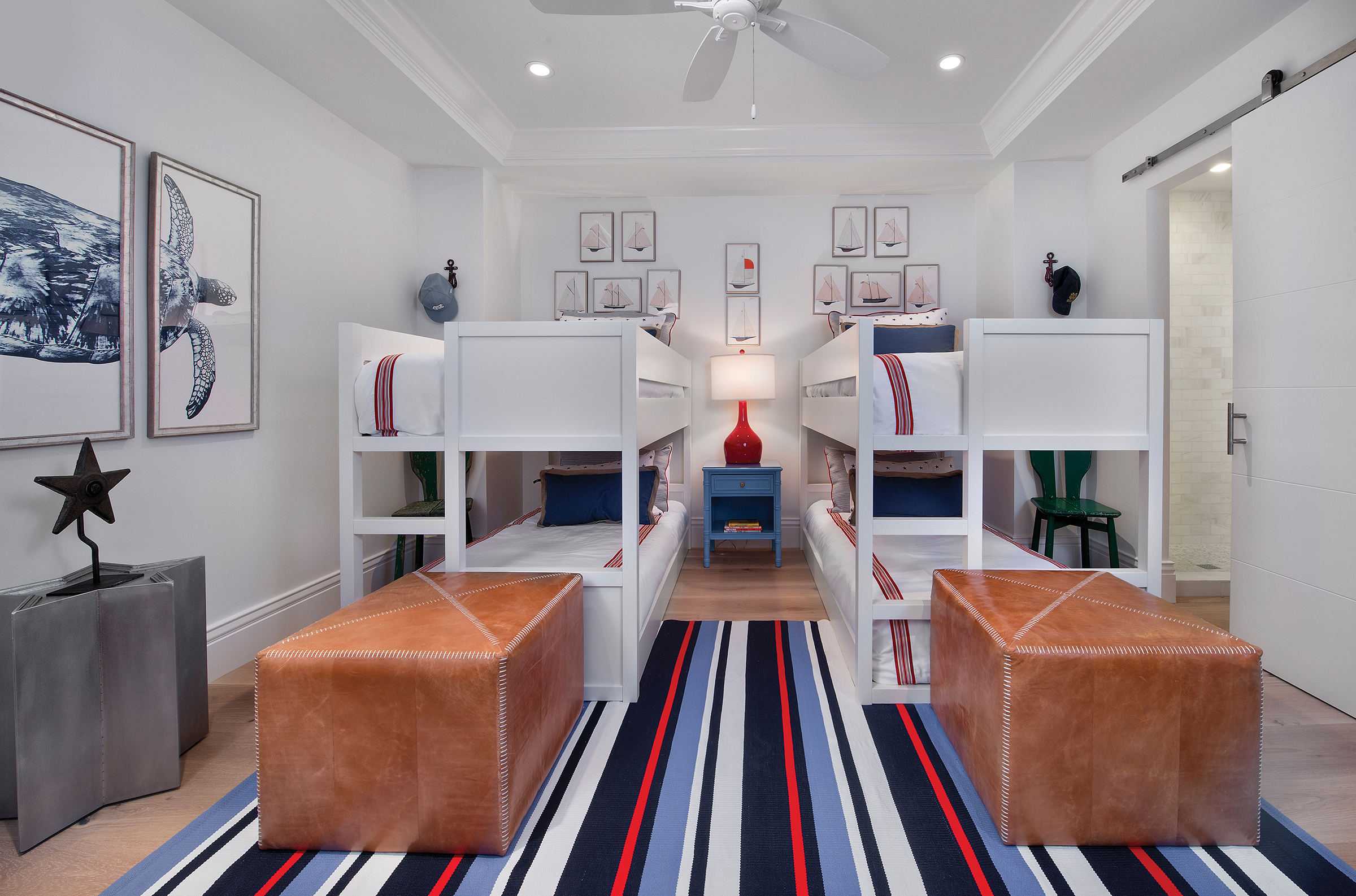  This room is beautifully appointed with nautical art and colors. The perfect place for a fun sleep over, twin bunk beds create plenty of sleeping space. Leather ottomans at the foot of the bed are a durable and fashionable seating option for kid-fri