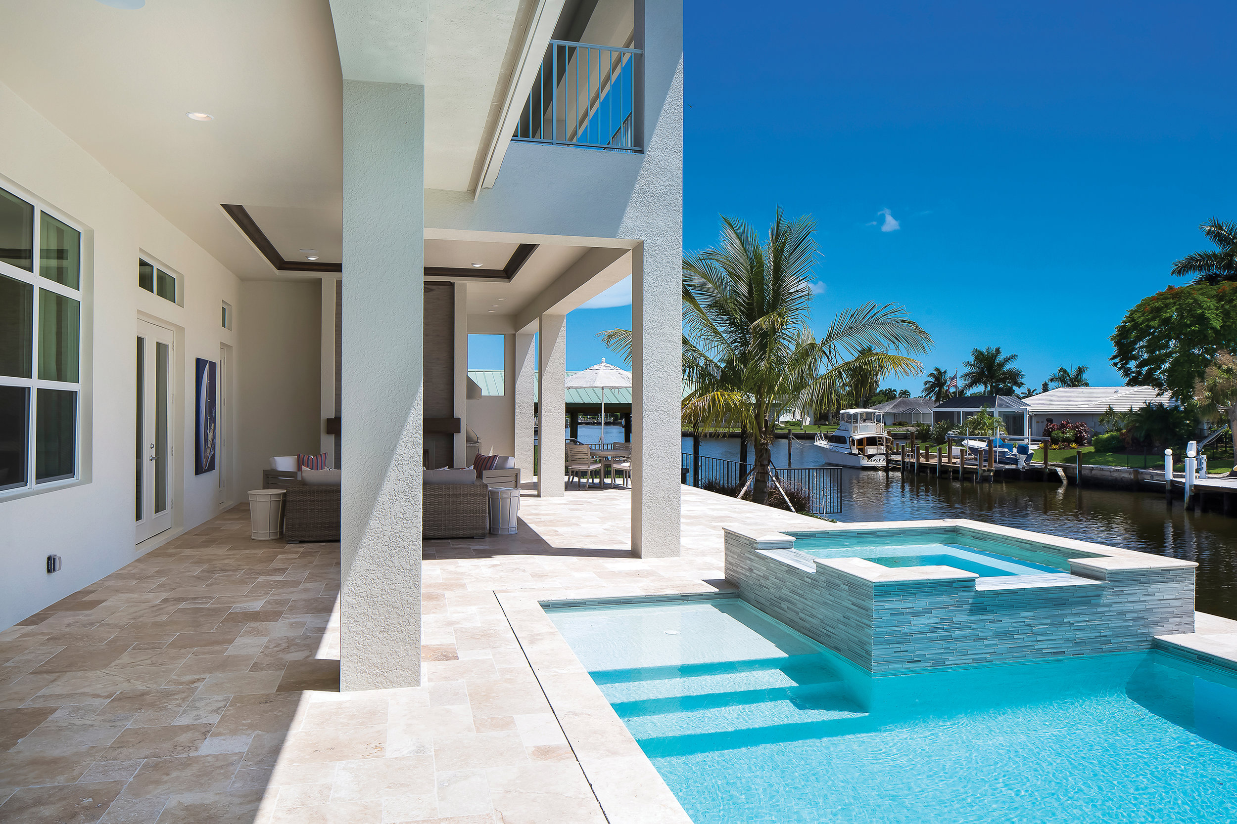  Oversized for the typical Marco Island home, the lanai allows for a nicely-proportioned pool right on the water. The aqua blue glass tiles on the spa and pool are stunning at any angle. Between the interior of the home, pool area, and the location, 