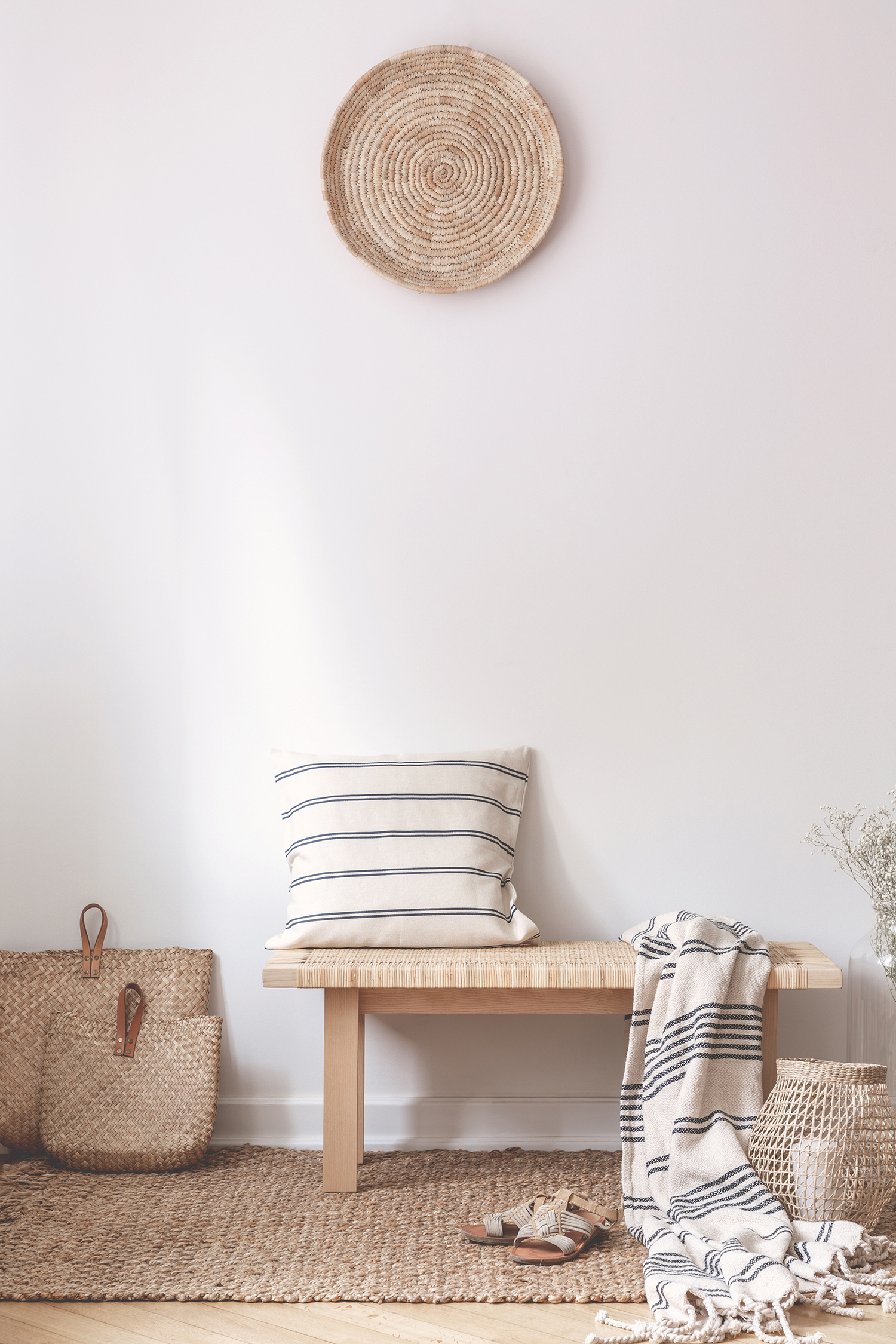 pillow-and-blanket-on-wooden-stool-in-white-5AGUDWR.jpg