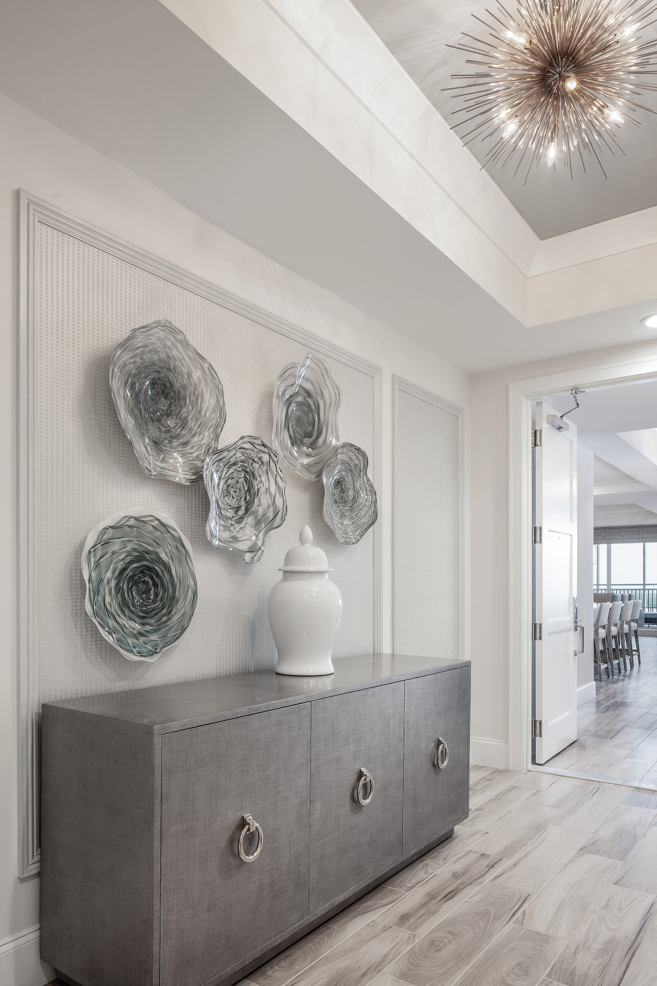  Diana Hall lent her expert eye to this serene home. “Soft, zen, and transitional, this elevator foyer is a hint of what’s beyond. These elevator lobby rooms are actually very public spaces as other residents will see them when the elevator doors ope