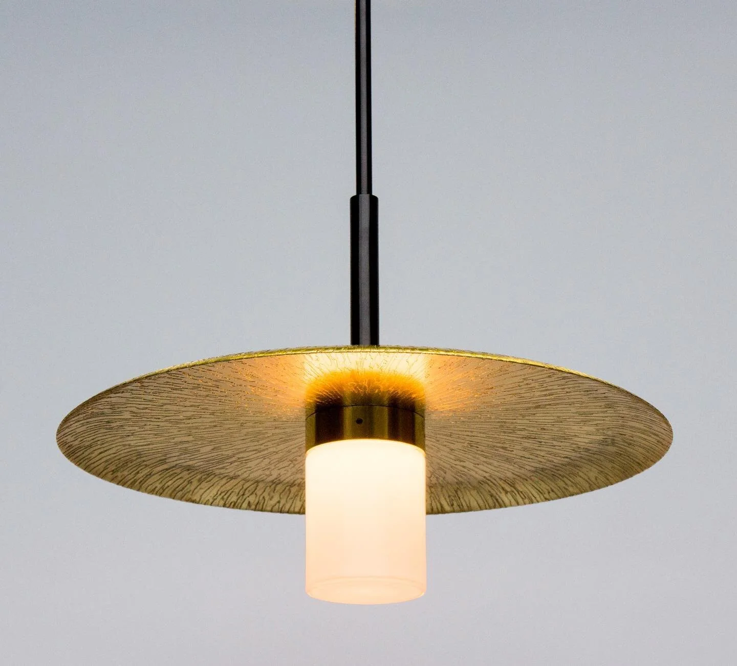 Our Arthur Pendant’s spun shade is the playing field for several unique hand applied textured reliefs or colored powder-coats. This versatile pendant can function as a solo attraction hanging above a small cocktail table or in a reading nook, b
