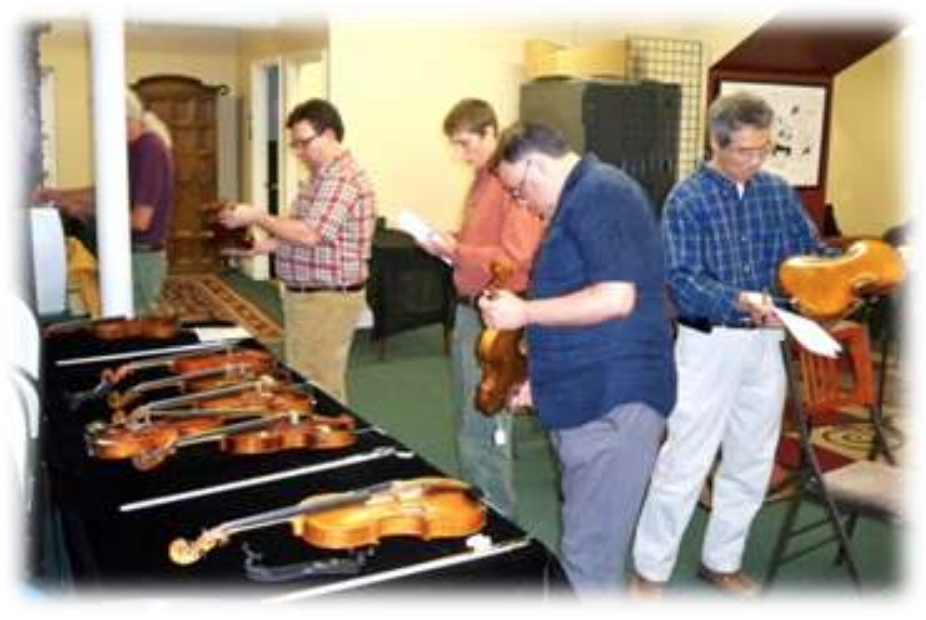 L to R: Joe Thrift (behind post), Russell Hopper, Kate Rickenbacker, Pablo Alfaro, and Young Kim inspect instrument
