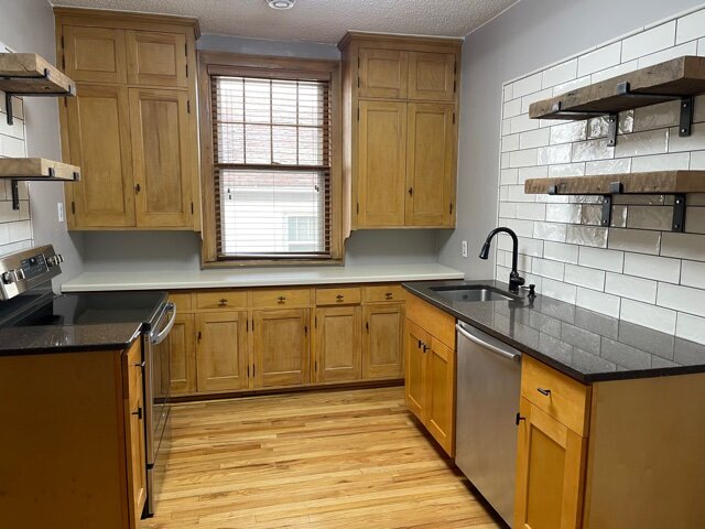 Updated kitchen with high end dishwasher, amish barn plank wide shelves, never been used, new stove.