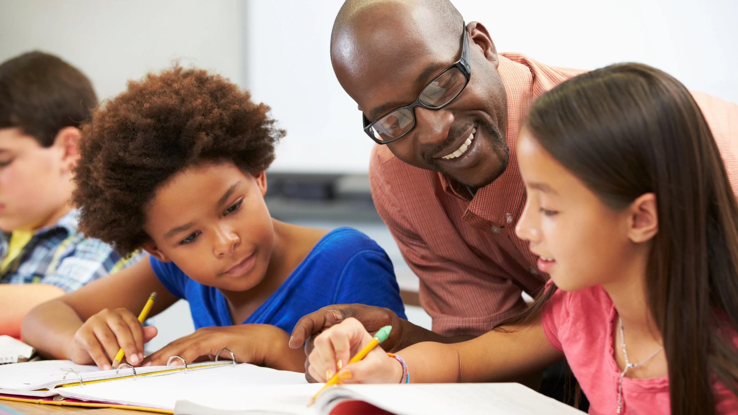 bigstock-Teacher-Helping-Pupils-Studyin-46023202.jpg