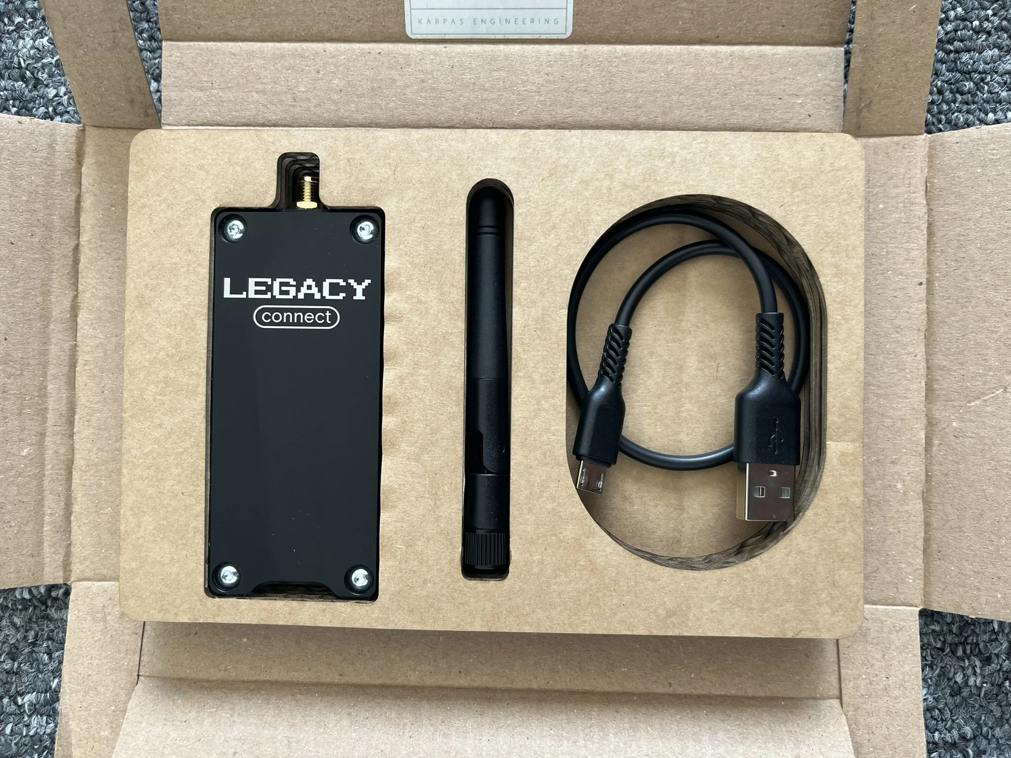 Legacy Connect USB device with laser marking in custom cut foam packaging by Karpas Engineering