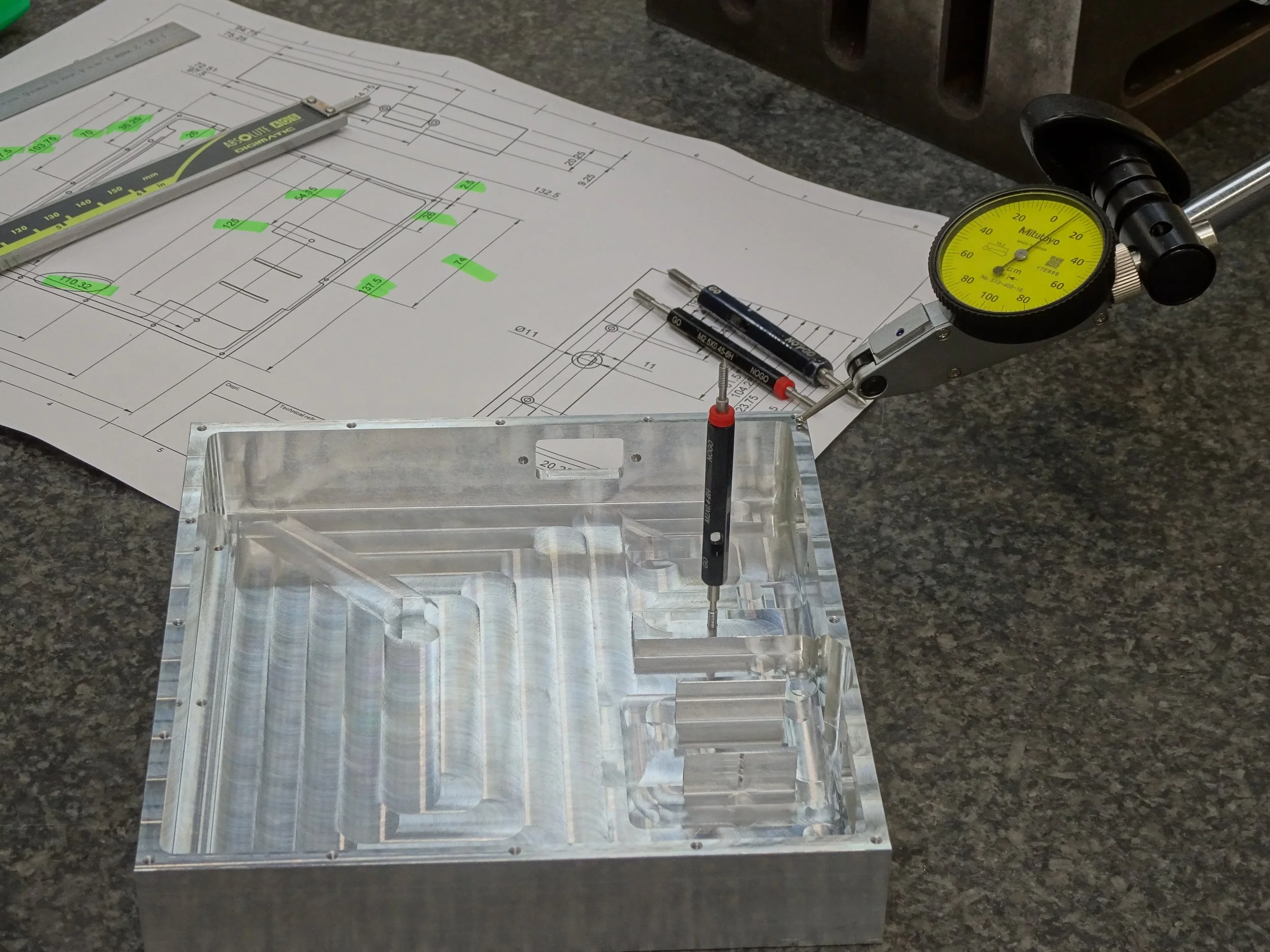 Prototype component undergoing dimensional QC inspection during development.