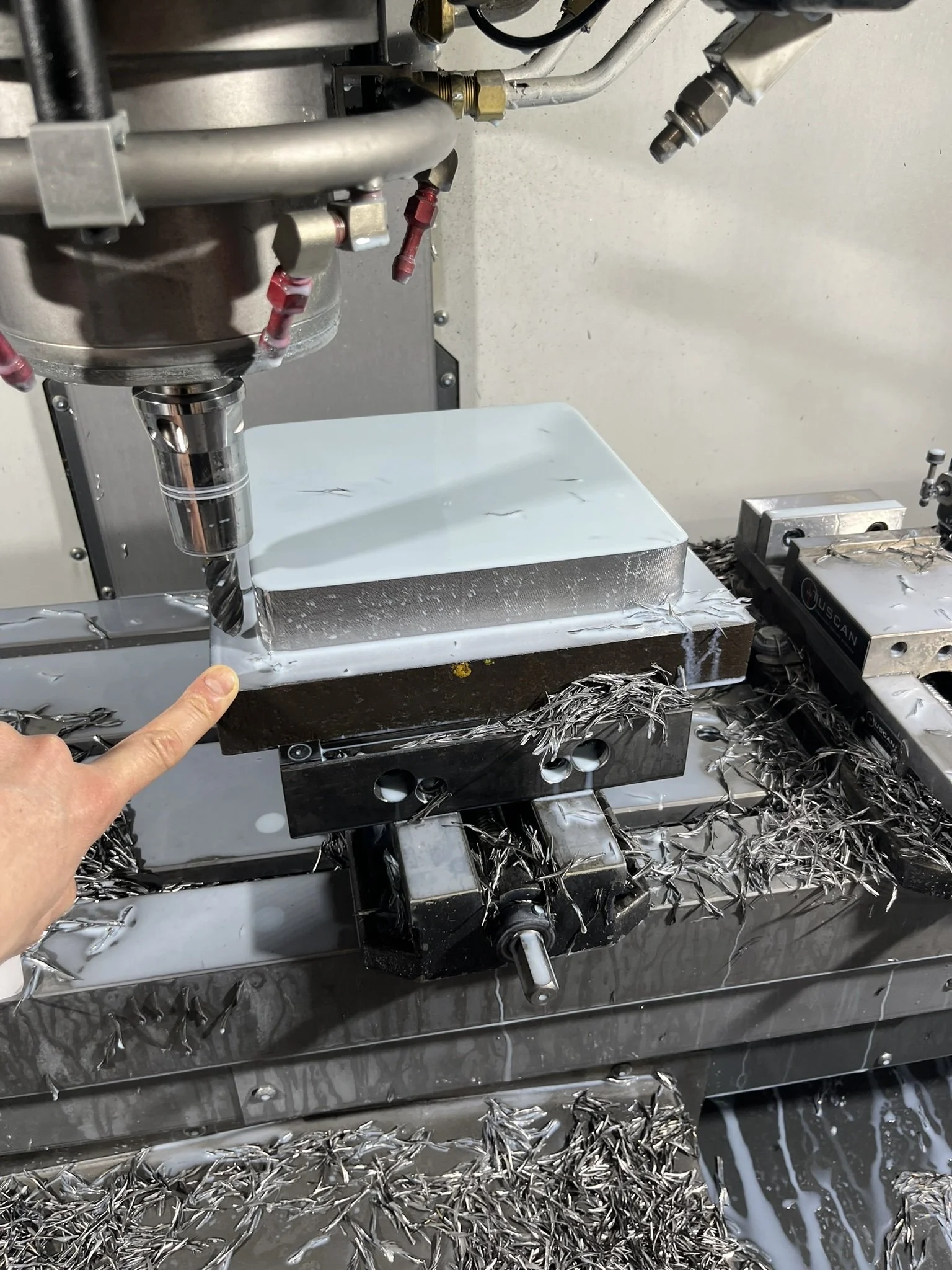 Large piece of aluminium prepared and set up for CNC milling prior to machining.