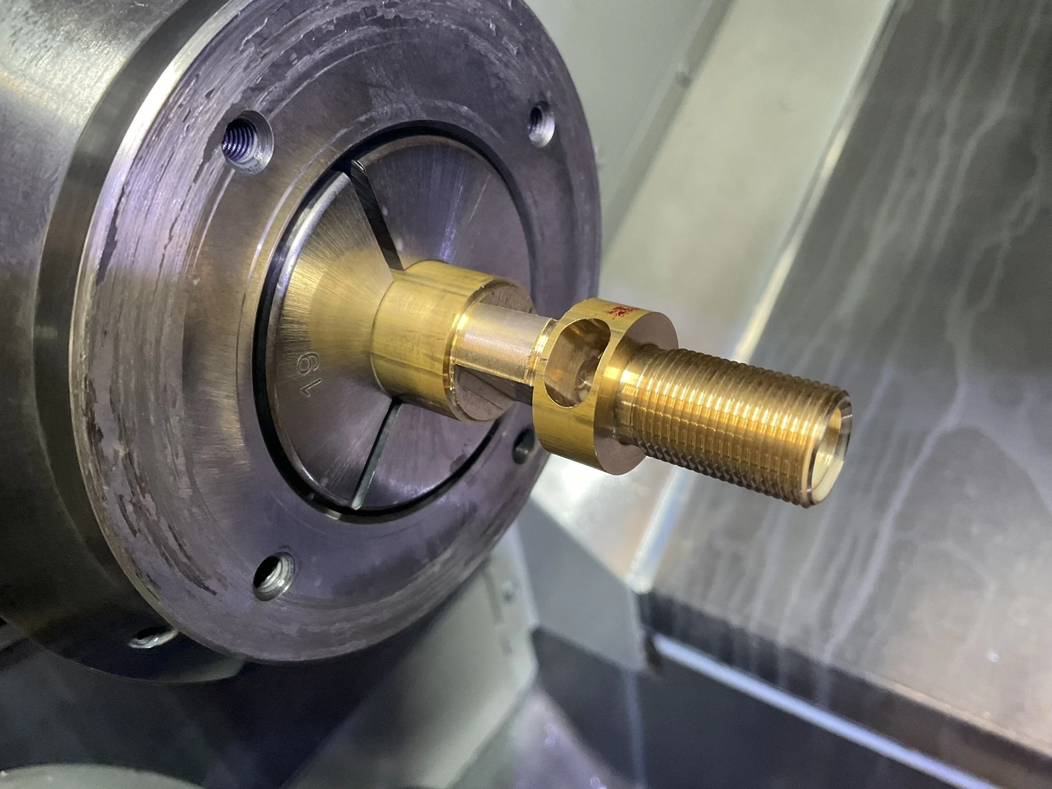 CNC-turned part in the ST-10Y with threads and milled cut-outs.