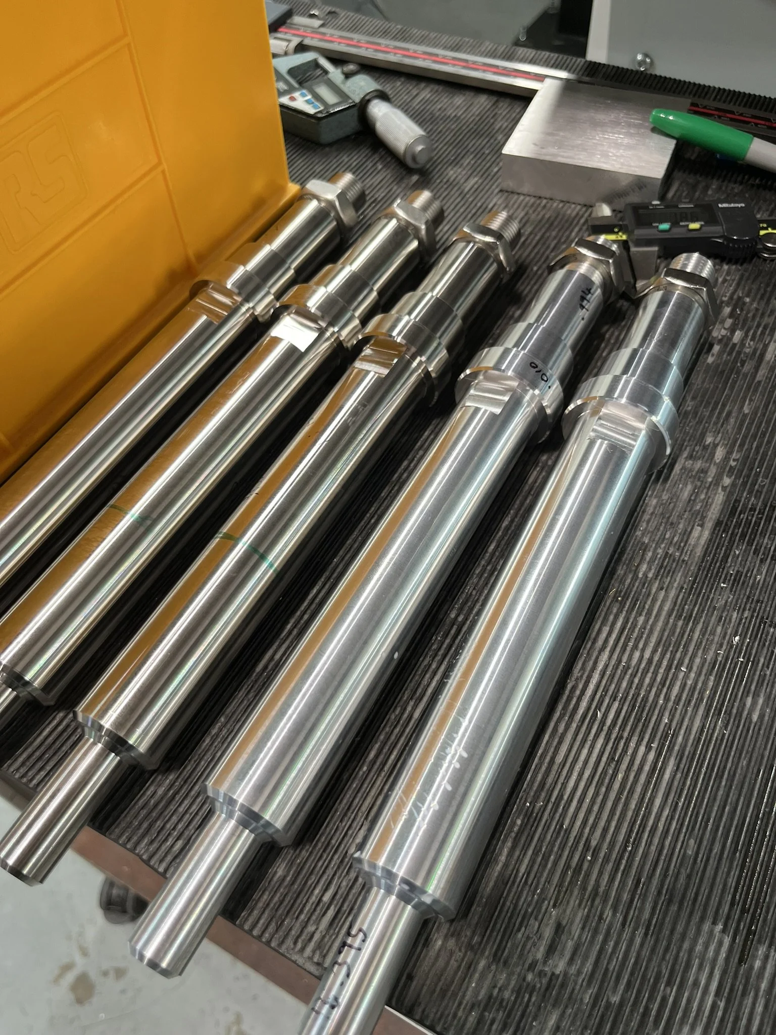 Large, long cylindrical component CNC-turned with features at both ends as part of a small production run.