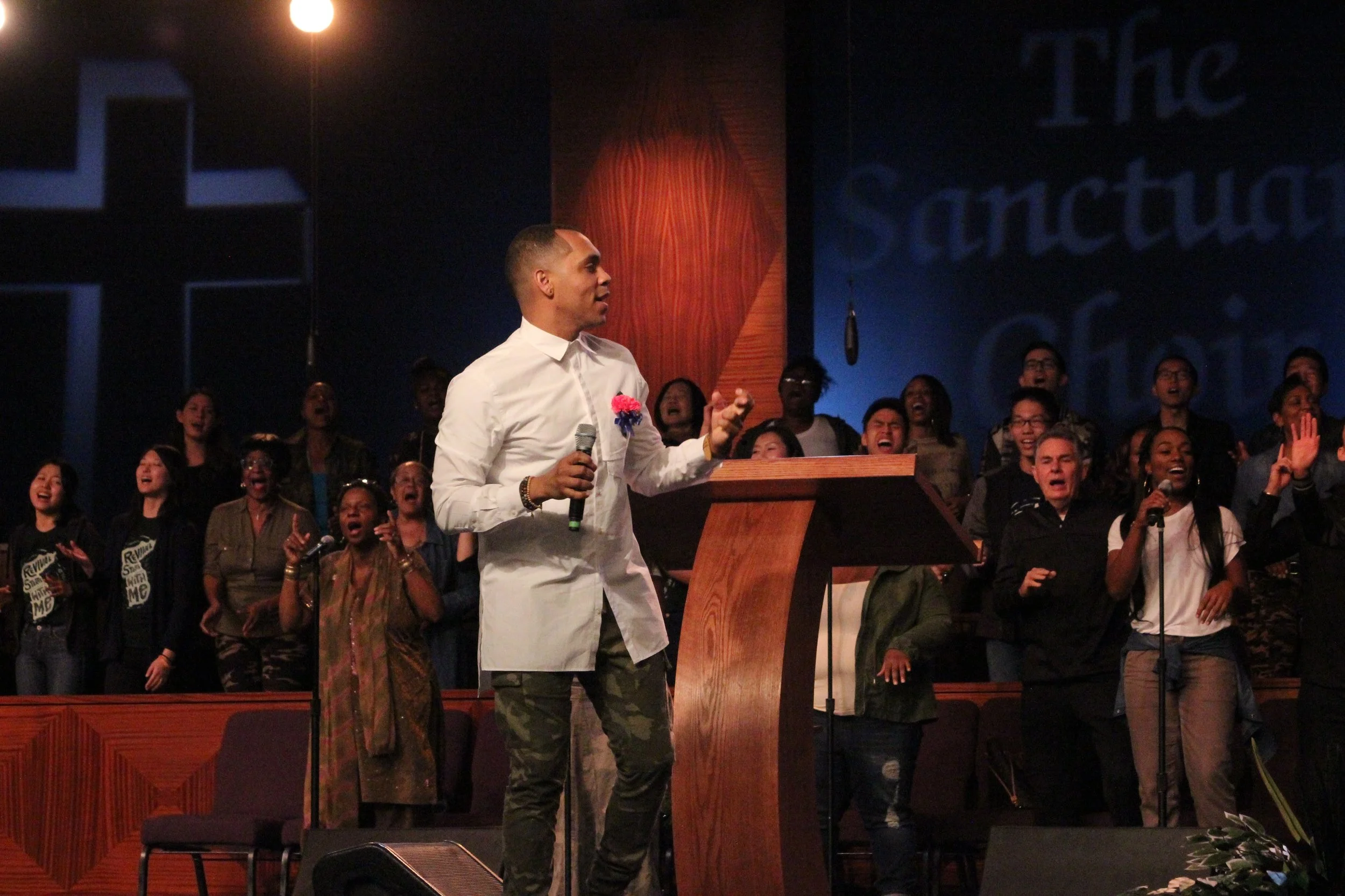 Jason McGee directs the choir on December 16th.
