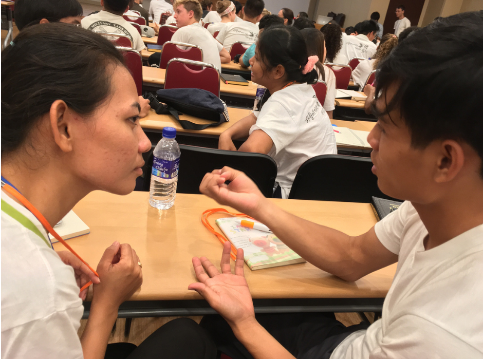 Participants engage in lively discussions.
