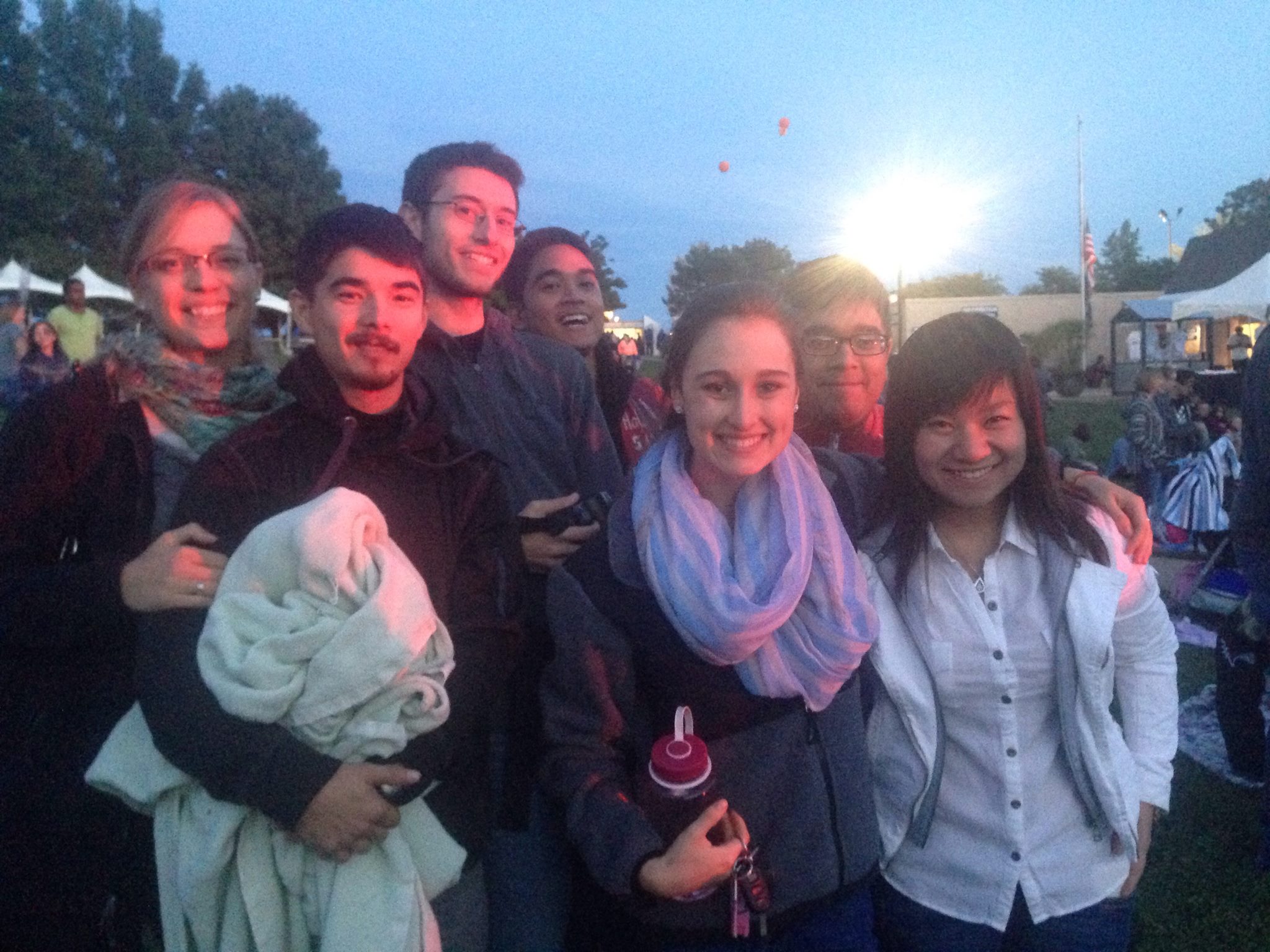 A young adult outing at an outdoor concert featuring Carly Rae Jepsen.