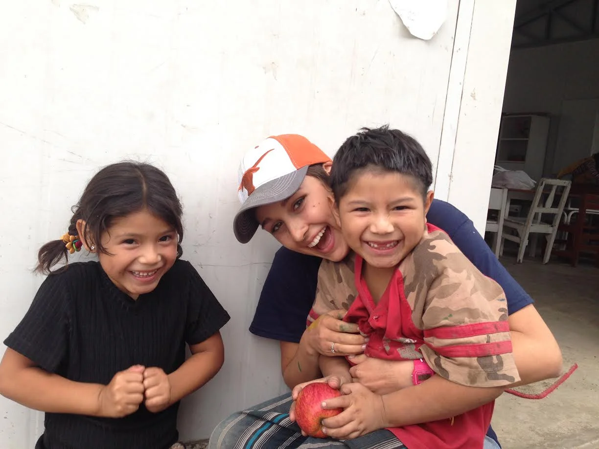 Kristin on a service trip to Peru helping to beautify a playground for the children of the community.
