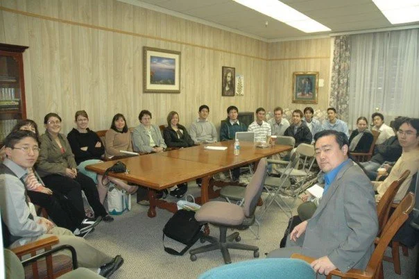 Naokimi (left) at a CARP meeting in 2007.
