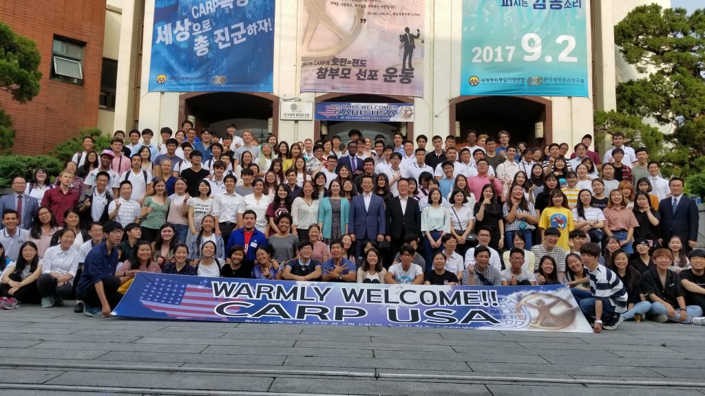 Group photo in front of the CARP Korea Headquarters