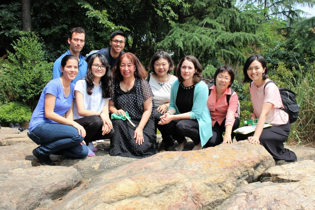 Staff members at the Rock of Tears in Busan