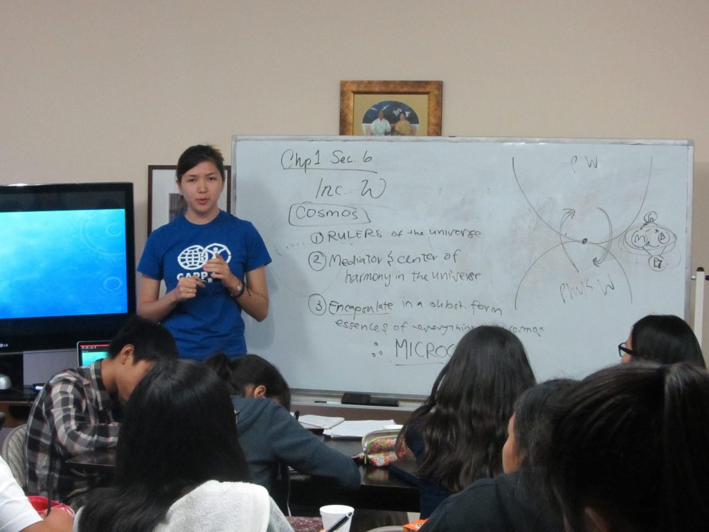 Jennifer Pierce sharing Unification Principles to high school participants. 