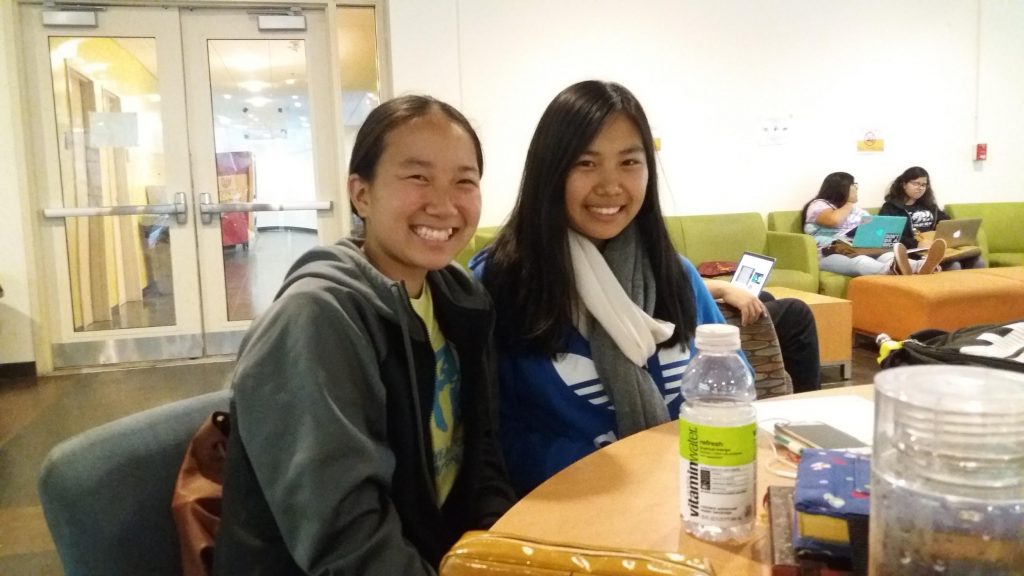 (L to R) Kayun Hiraki and Naomi Kotani learning from CARP members at Pasadena City College (PCC). 