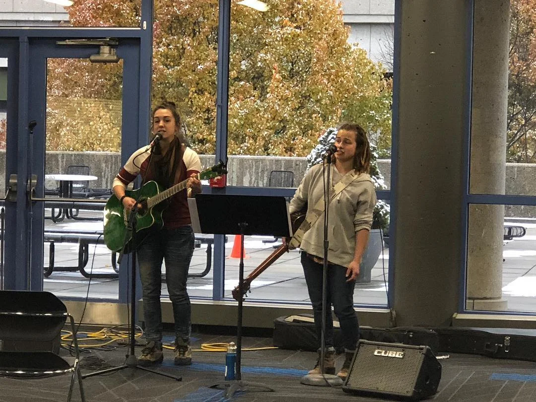 Kaitlyn Zittel and Isabel Zittel performing their original song for the event.