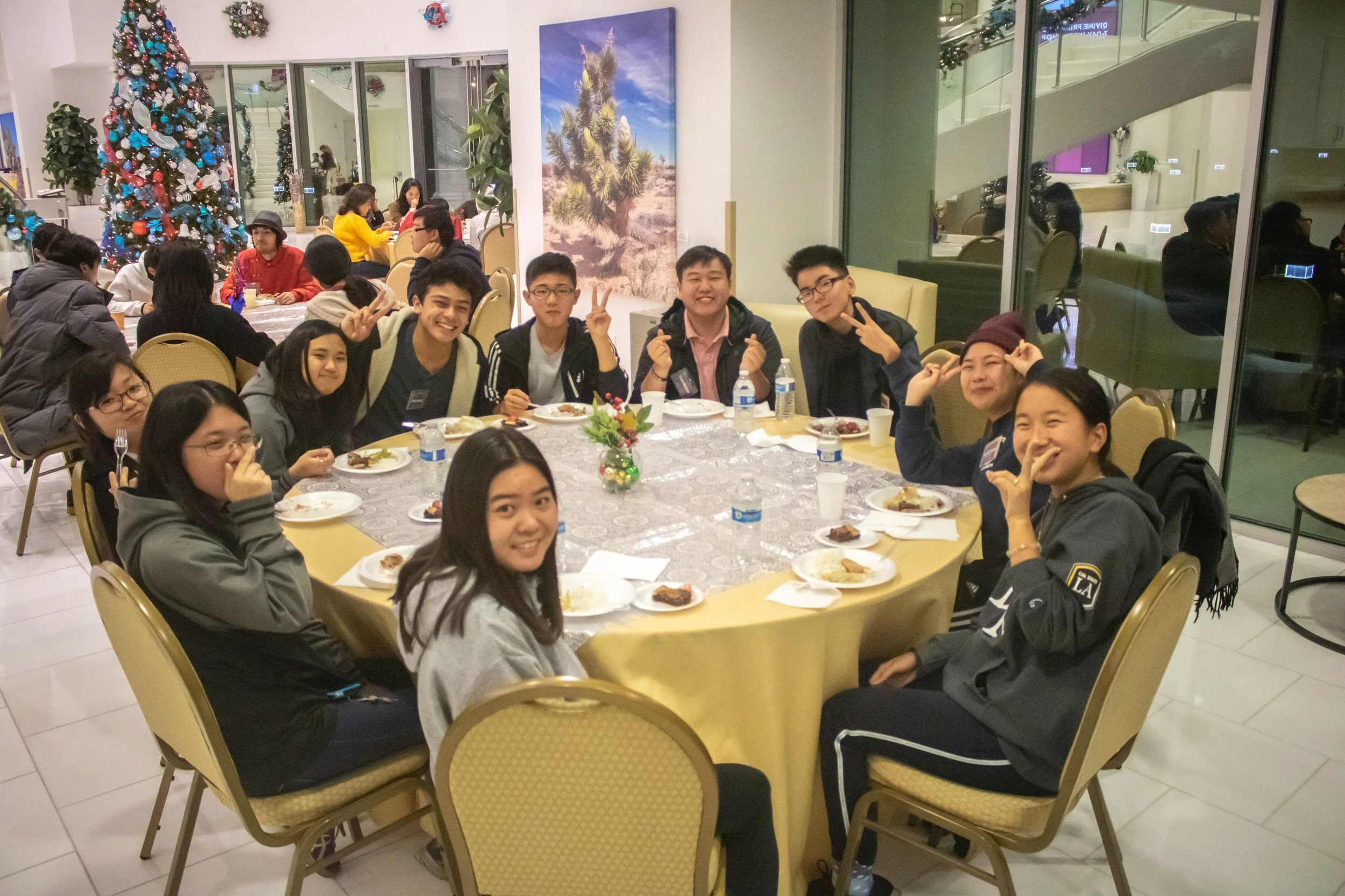 The high school group eats together.