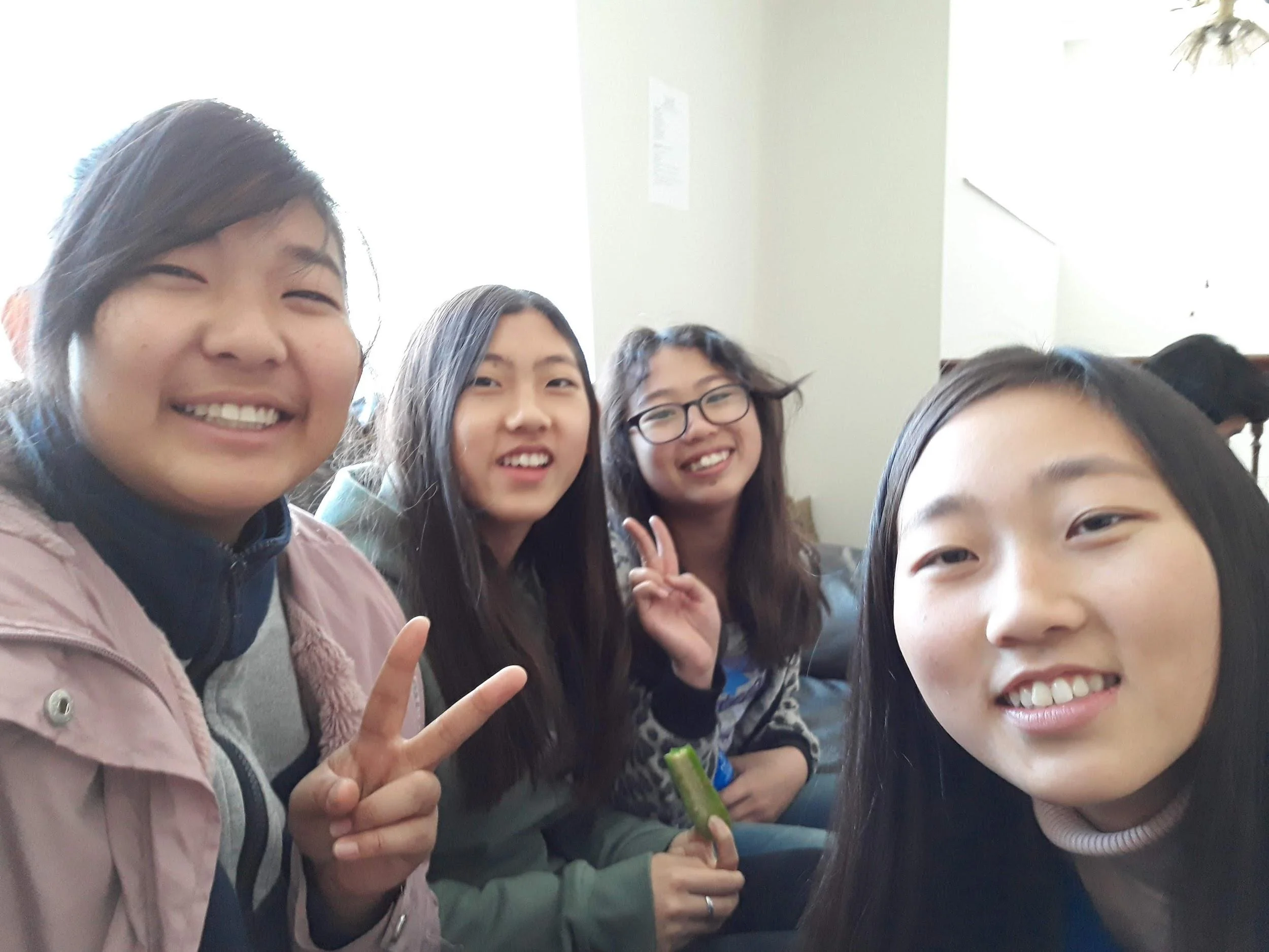 Kana Ishii (left front) and Yeon-su Hwang (right front) return from their gap year program for winter break to join the retreat.
