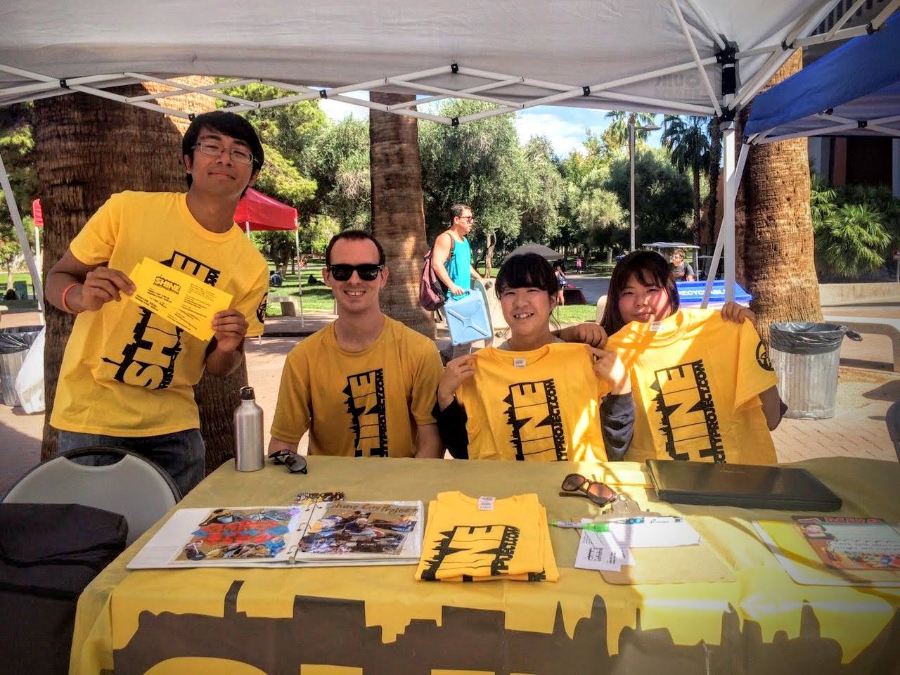 Passing out flyers and sharing about Shine City Project at the UNLV Involvment Fair in September 2015 with volunteers and John Everett, a student officer for SCP.