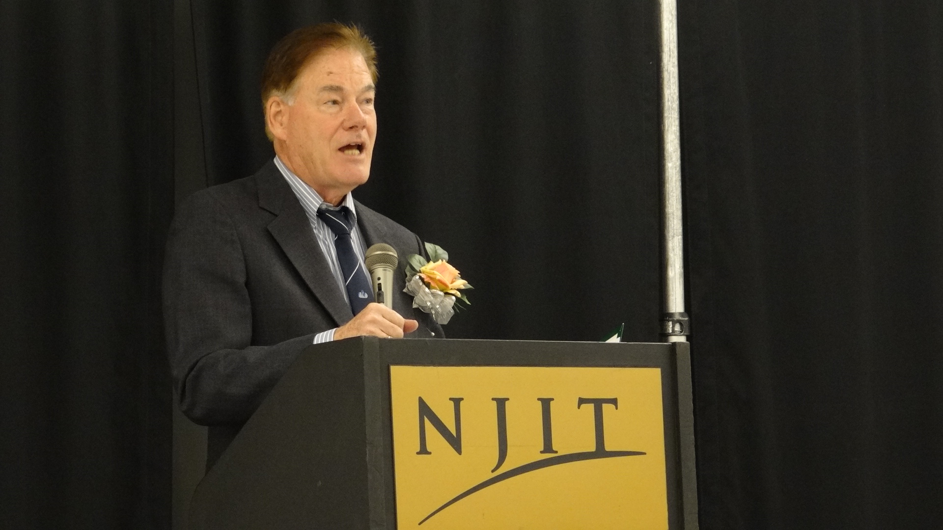 Mr. George Allen at the podium during his speech.