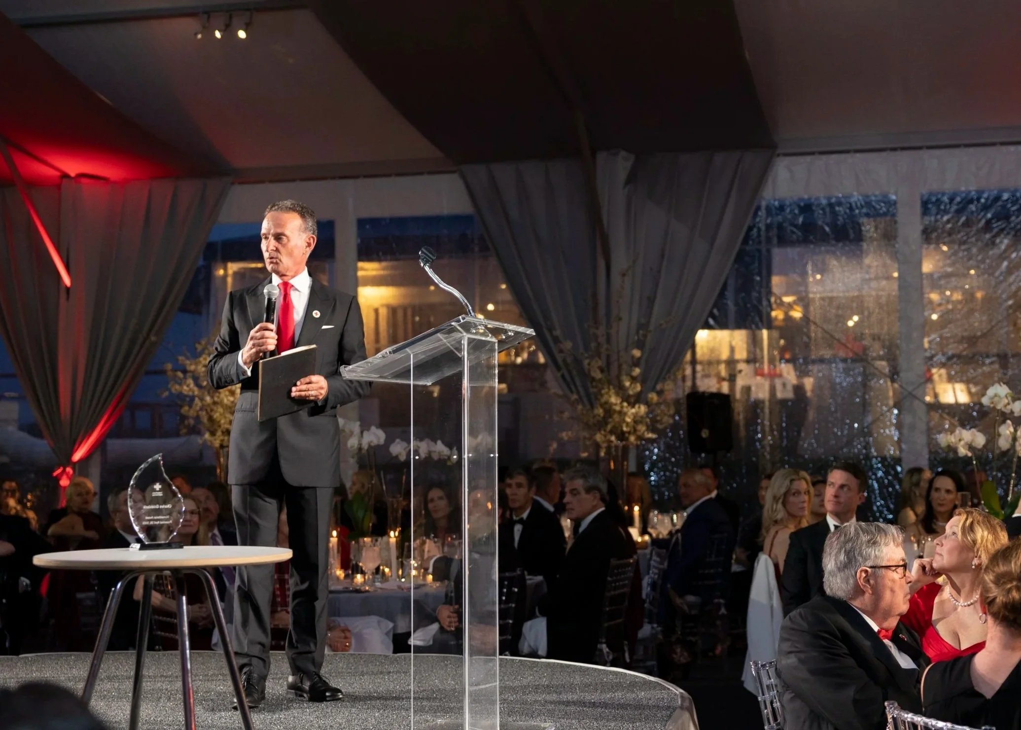Charles accepting the 2025 Humanitarian of the Year Award at the American Red Cross Red & White Ball