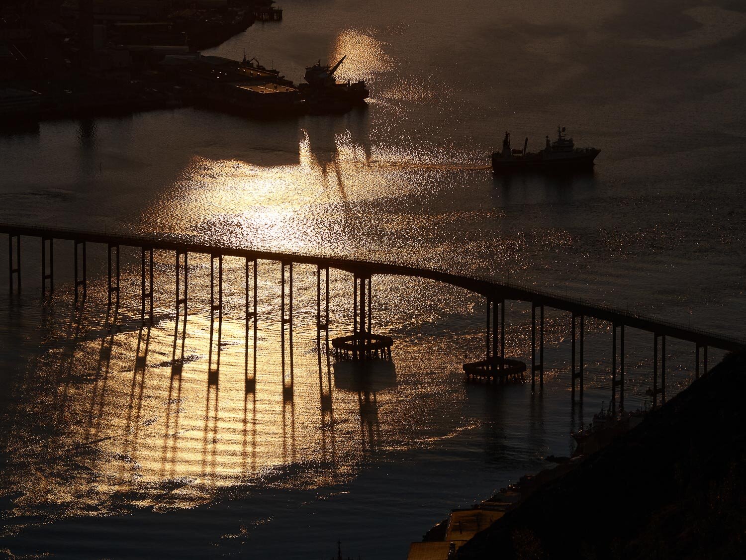 Midnight sun at Tromsø Bridge, Norway.