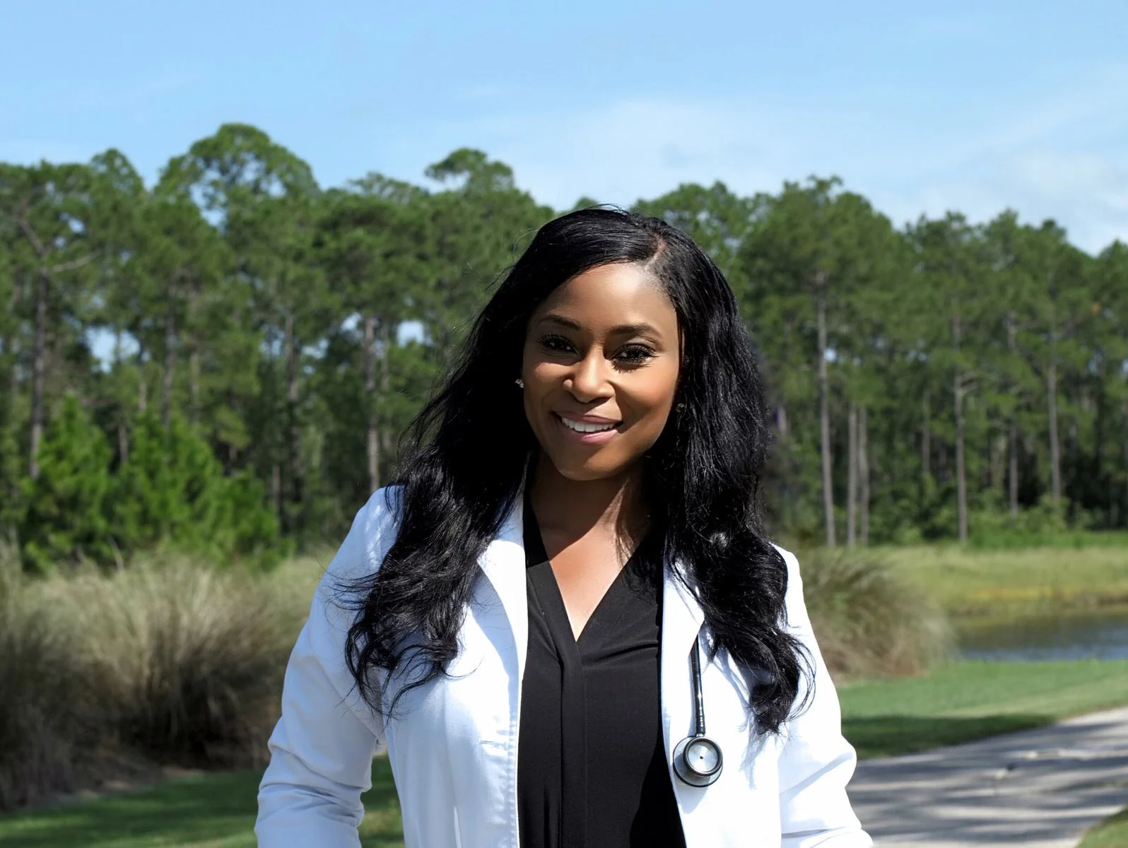 African-American Woman in White Lab Coat and Stethoscope.jpg