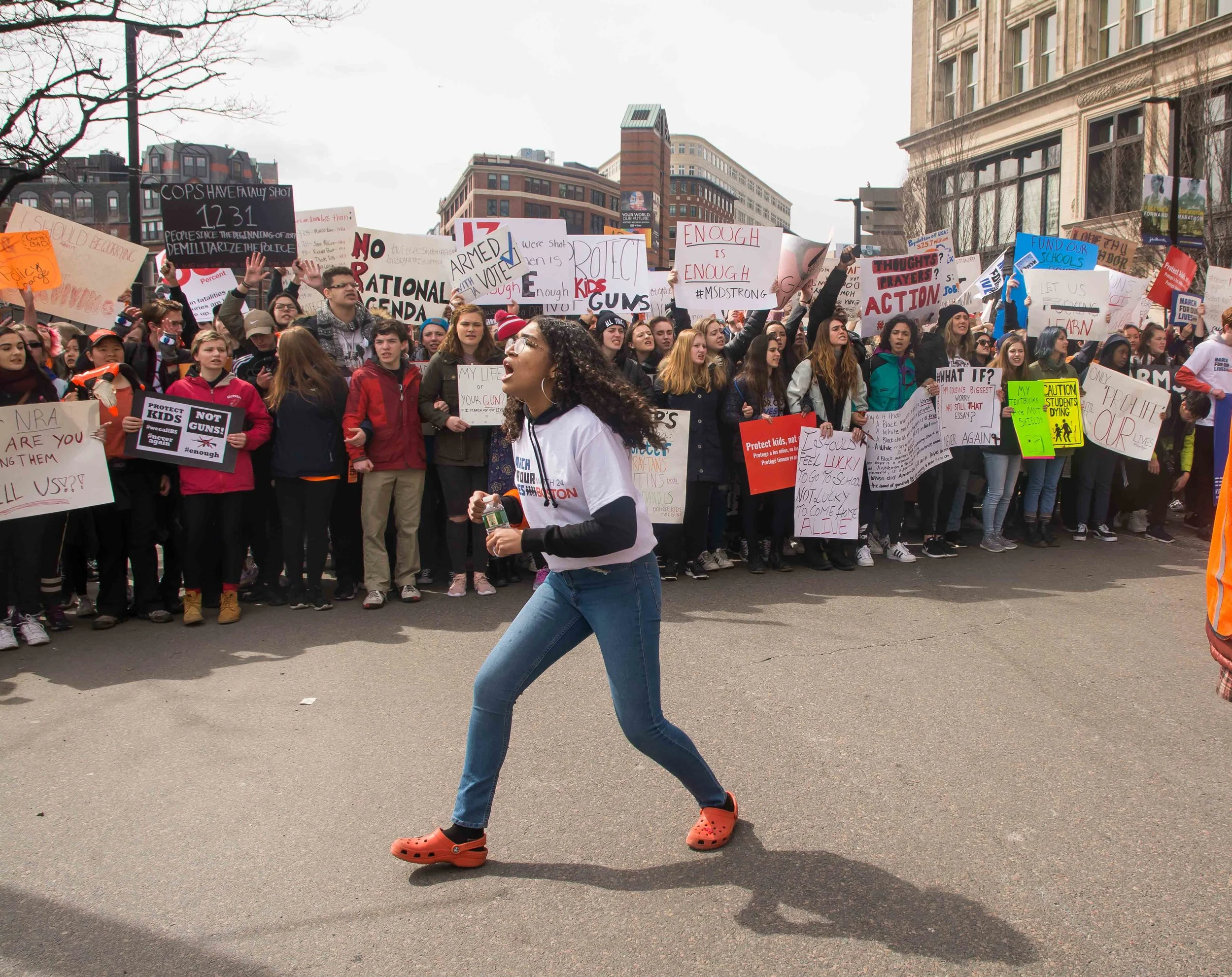 Laura-Luiza Gouvêa leads a chant as March for Our Lives particpants move towards Boson Common.