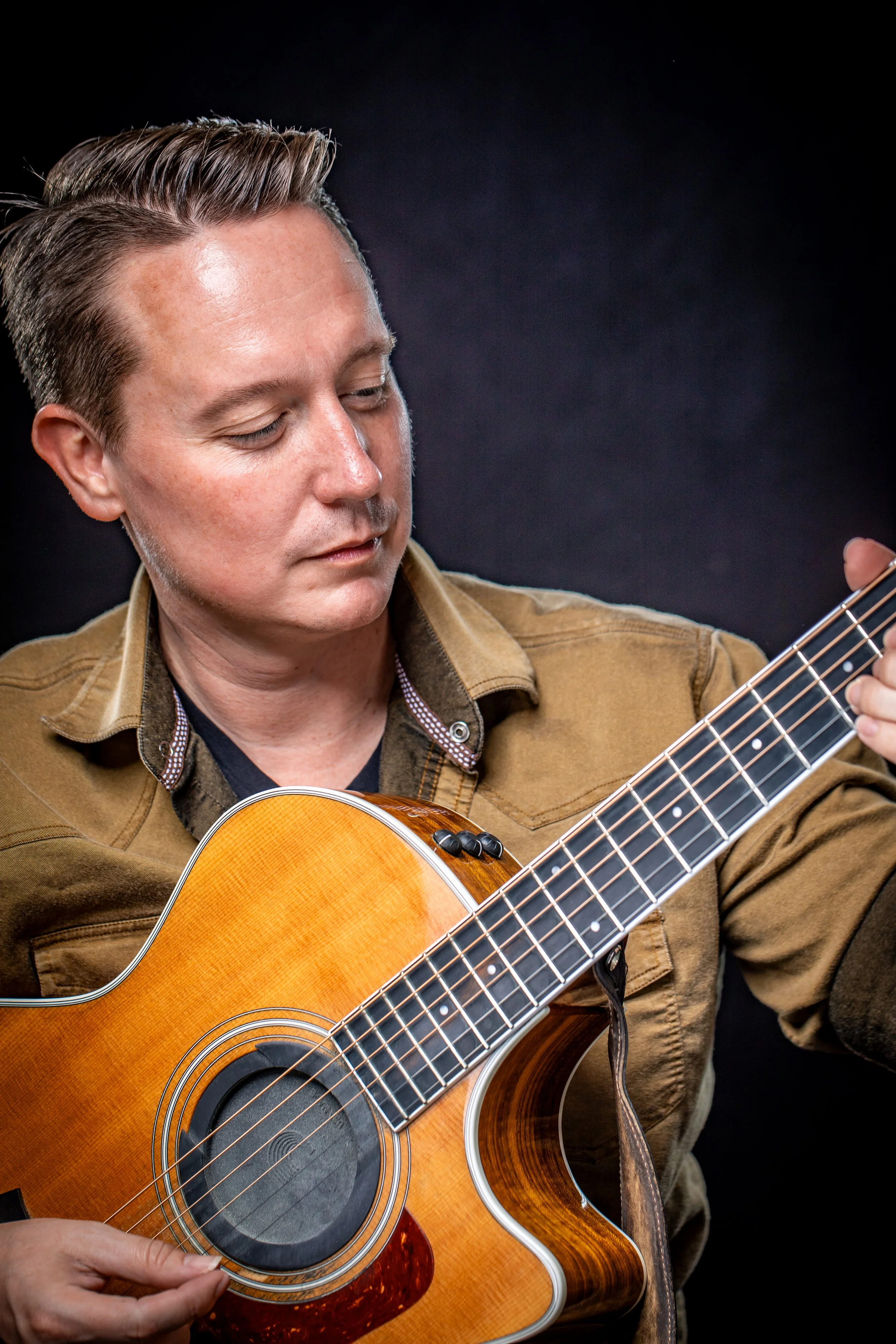 Holding Guitar Color Brown Shirt.jpg