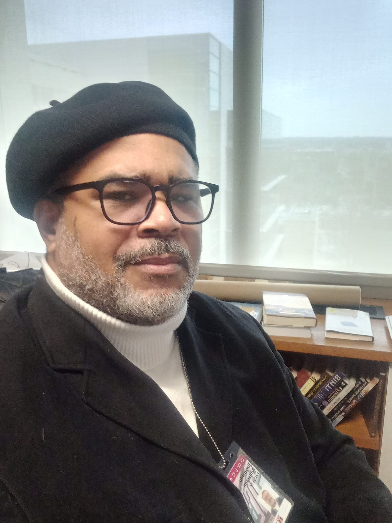 Dr. Reynaldo Anderson sits at his desk at Temple University