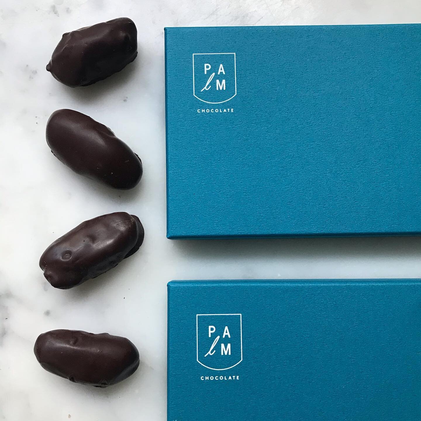 Our Almond #DateBox is a simple pleasure. Smooth and snappy 100% dark chocolate enrobes the juiciest Deglet Nour dates of the season, which suddenly feel like and taste like the sweetest gooey caramel as you sink your teeth in and then feel the crunc