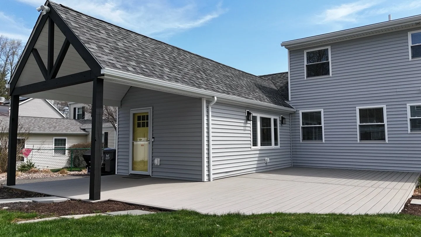 New backyard for our friends in Trumbull. This updated design includes new windows, siding, roofing, decking and gutters.