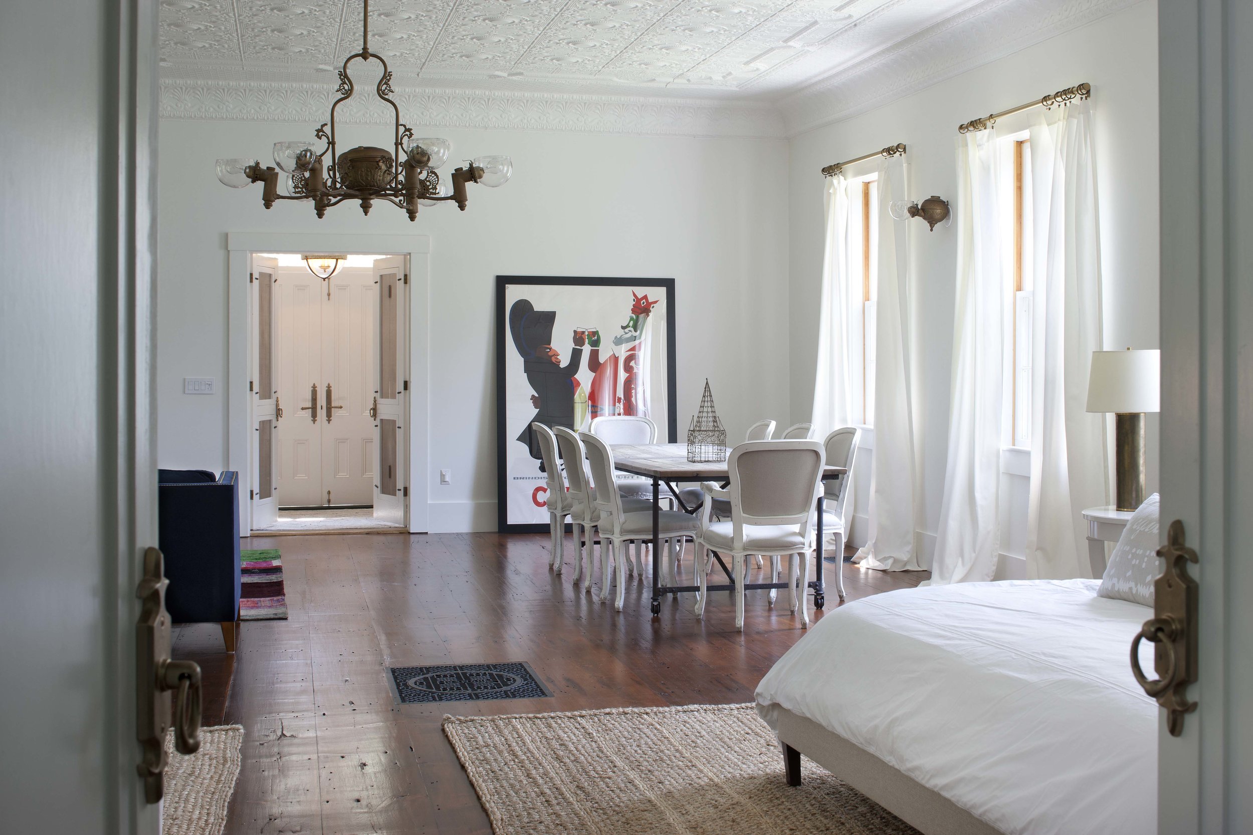  Bedroom with small table and chandelier.  