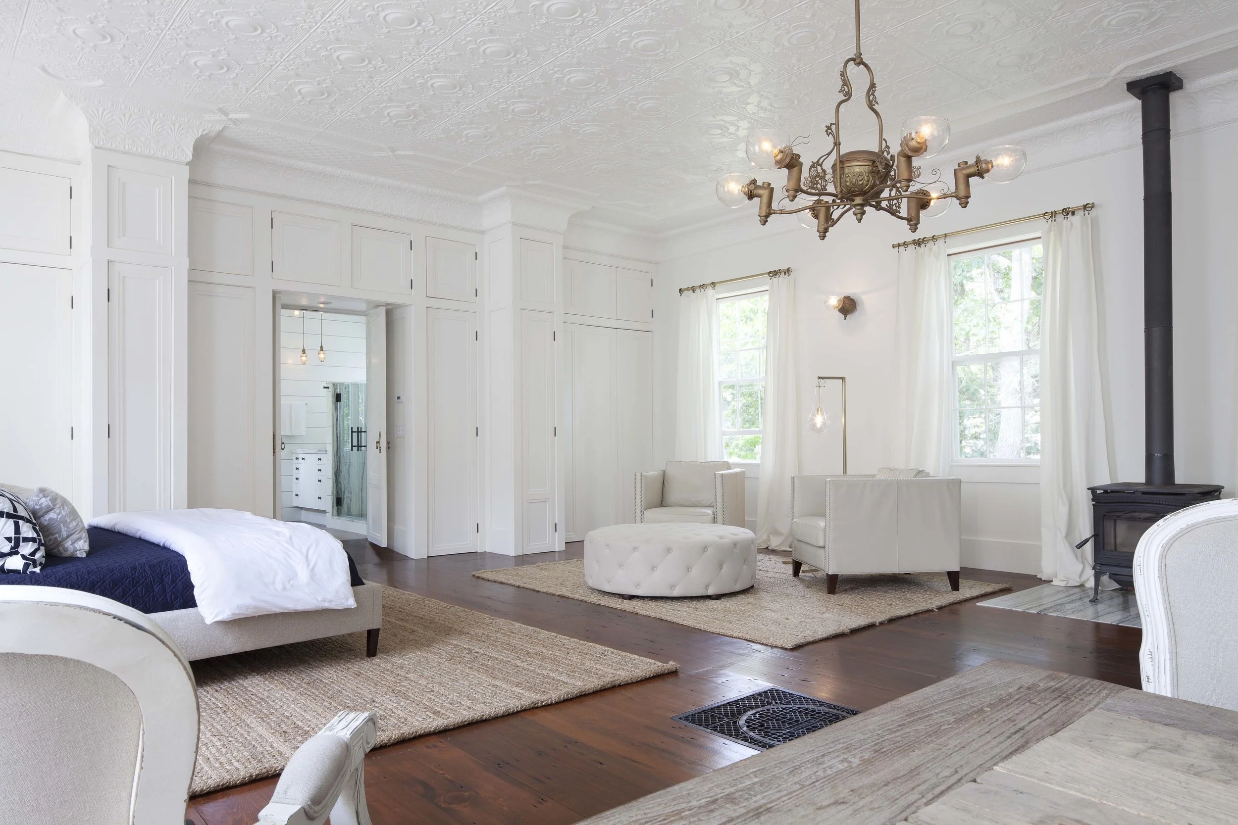 Master suite with tin ceiling and antique chandelier.