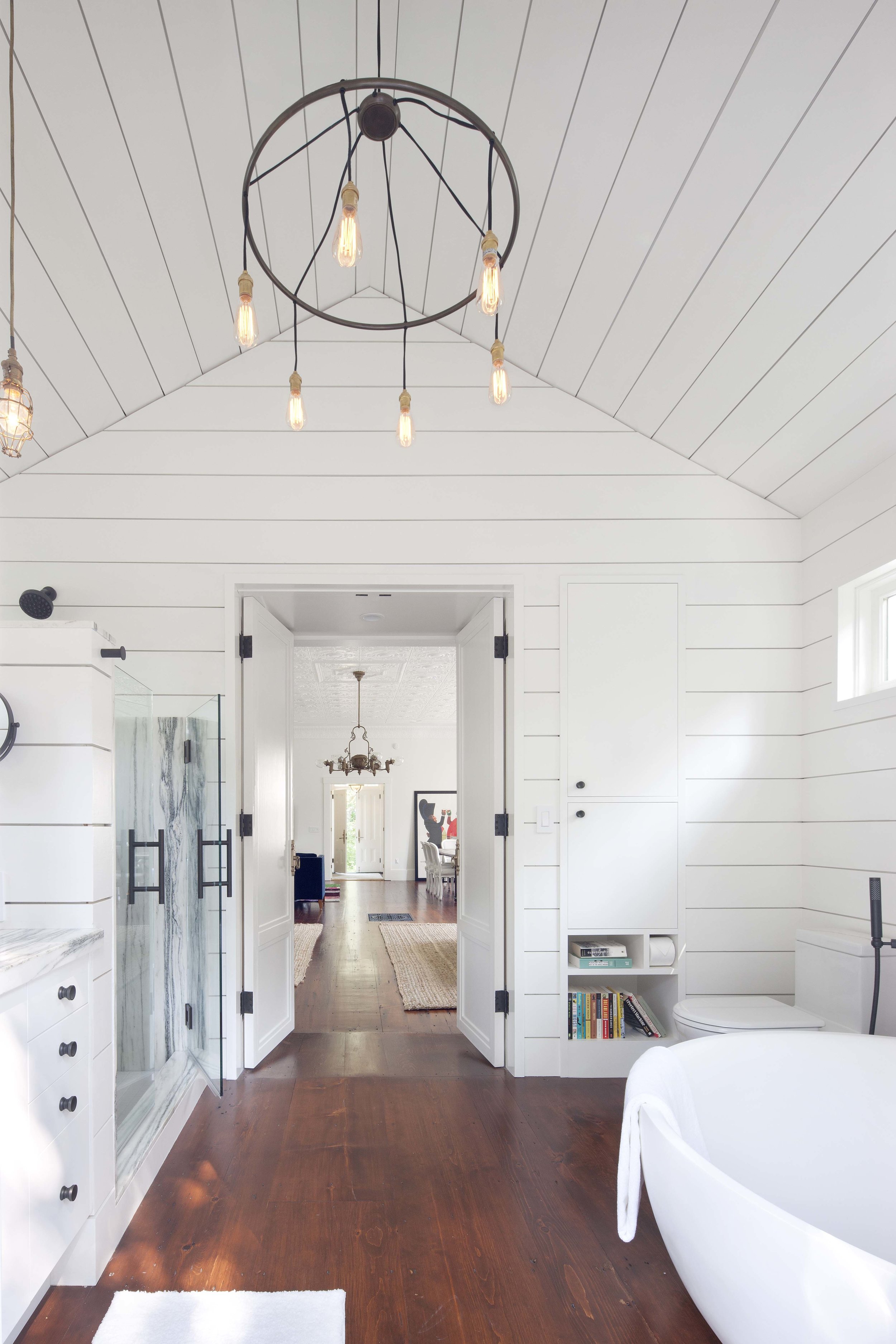  Martha’s Vineyard master bathroom ship-lap with modern chandelier. 