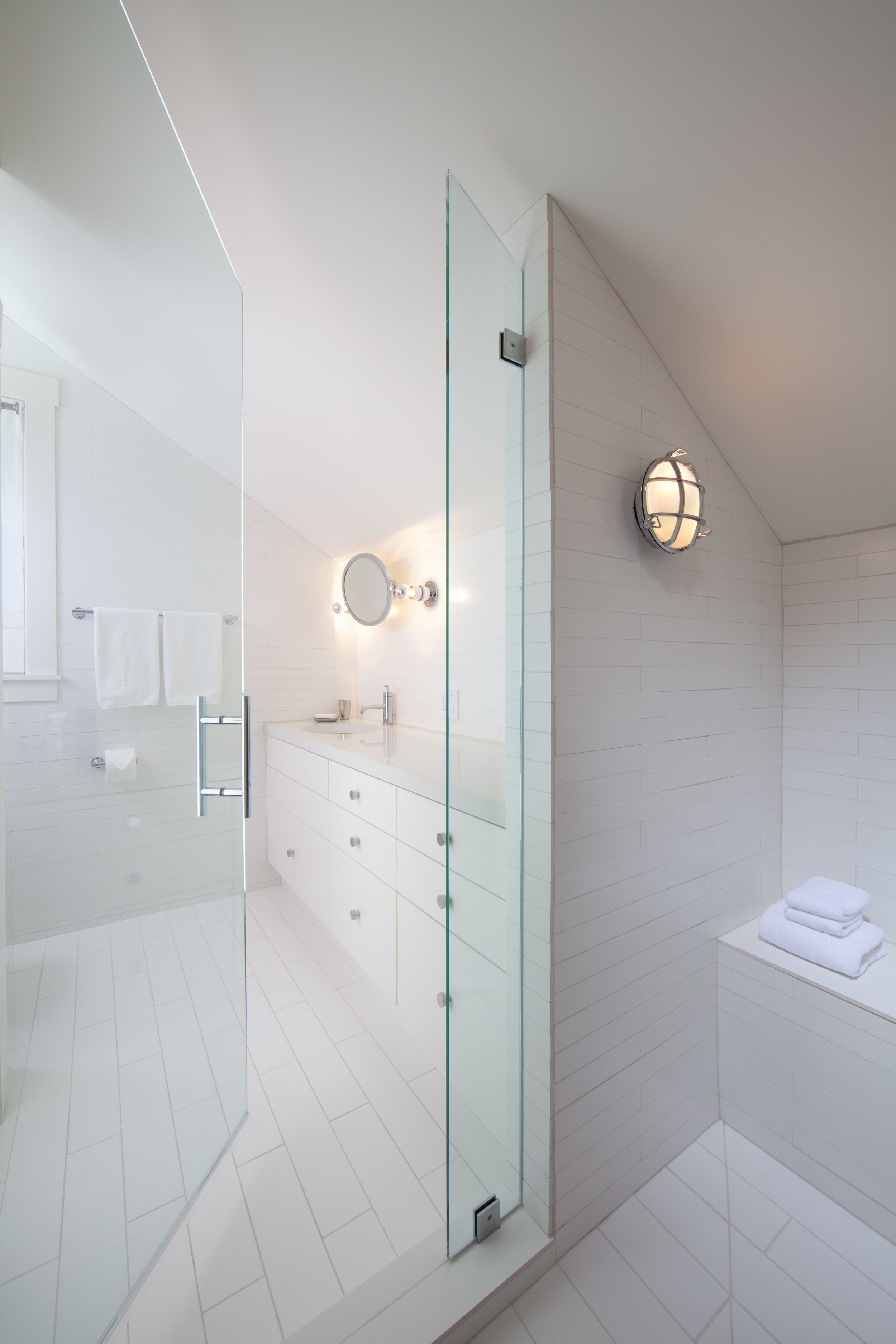  Ann Sacks tile white bathroom with nautical lights.  