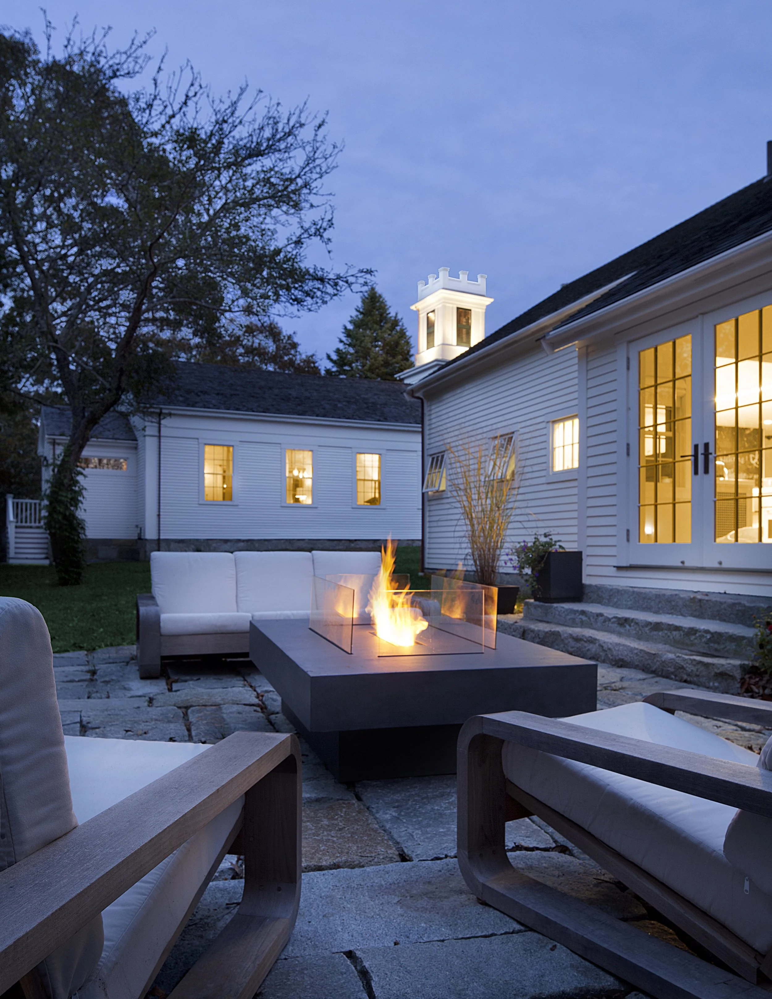 Martha’s Vineyard granite patio with fire table.