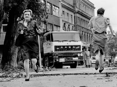 In this photo from 1992, women run across "Sniper Alley" under the sights of Serb gunmen during the siege of Sarajevo. Tom Stoddart/Getty Images from NPR story