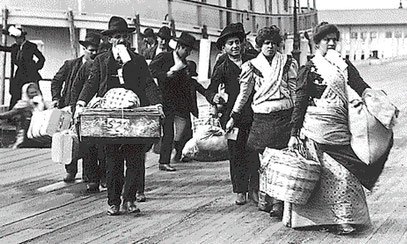immigrants-arriving-at-ellis-island-from-the-barge.jpeg