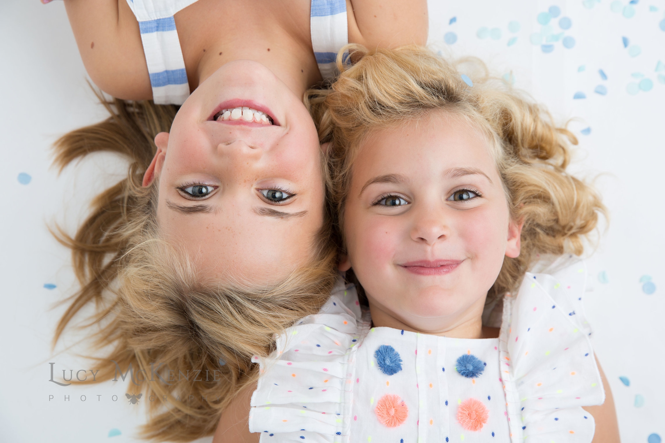 Children's professional photography - sisters having fun