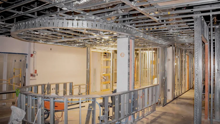 Metal stud framing in progress on a dental office build-out