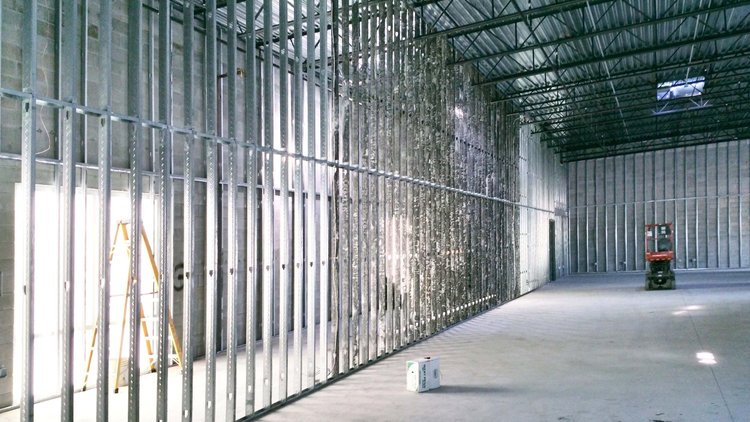 Long run of metal stud framing in a retail space
