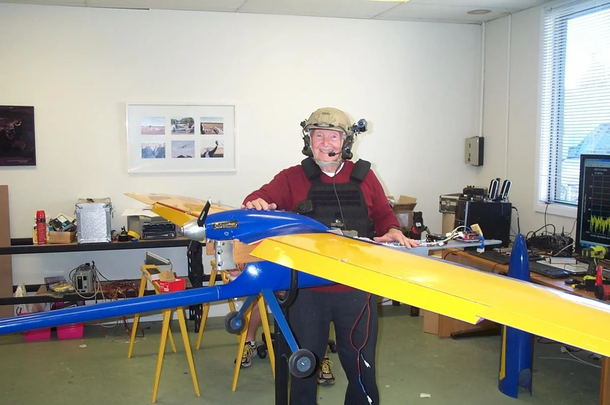 Bob Young kitted out with comms gear standing by a Mark 2 Flamingo in the old Silvertone Wagga workshop.