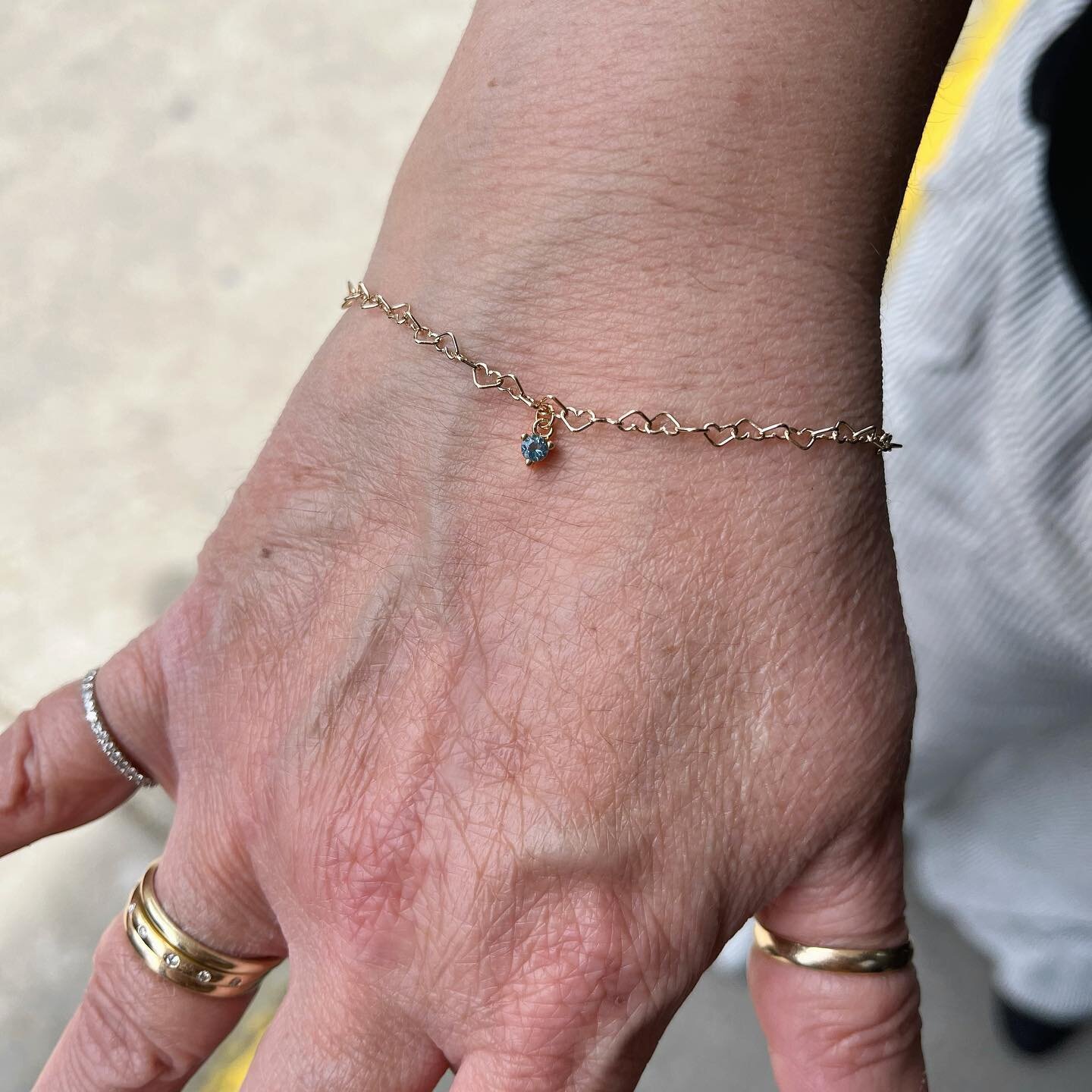 A sweet little Mother&rsquo;s Day treat - a permanent bracelet in 14k yellow gold featuring a genuine aquamarine charm. 

SPARK ⚡️ by @buildbycowpok offers permanent jewelry appointments for pieces you never have to take off. Book your next appointme
