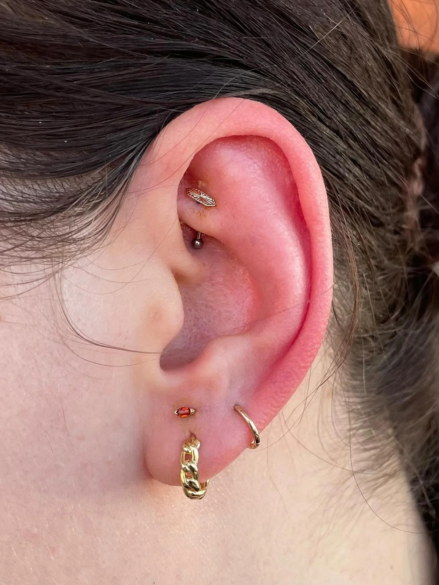 We are loving this stacked lobe with a garnet Zuri end from @buddhajewelryofficial - paired nicely with the Moxy end in a rook ✨

We are taking walk ins every day until 6pm - stop in or book your next appointment through the link in our bio!