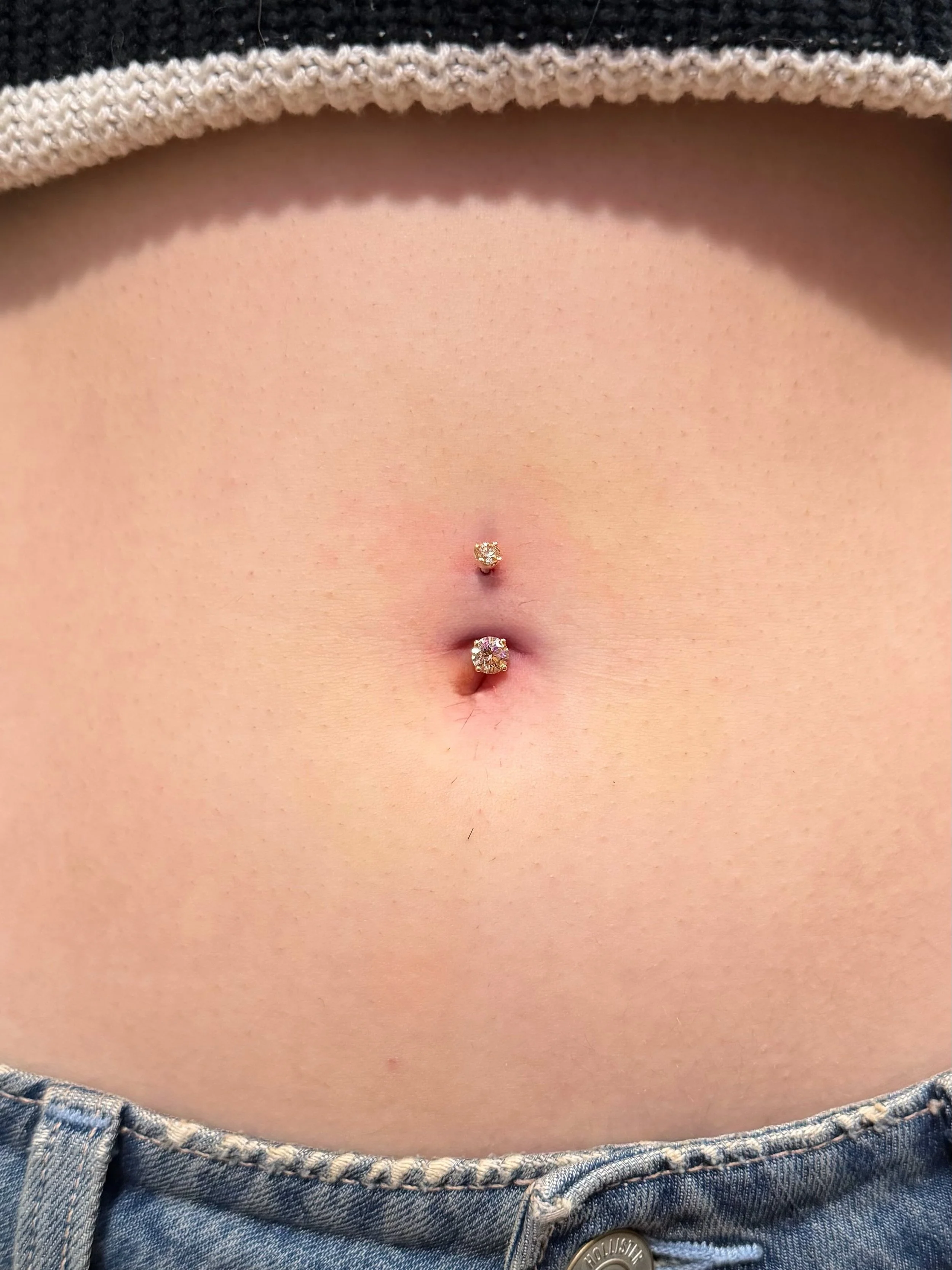 Fresh navel piercing using our hybrid gold and steel navel curve - featuring champagne hued Swarovski crystals, from our friends at @leroifinejewellery. Pierced by @bananzaaaa + styled by @megan.keefe ✨