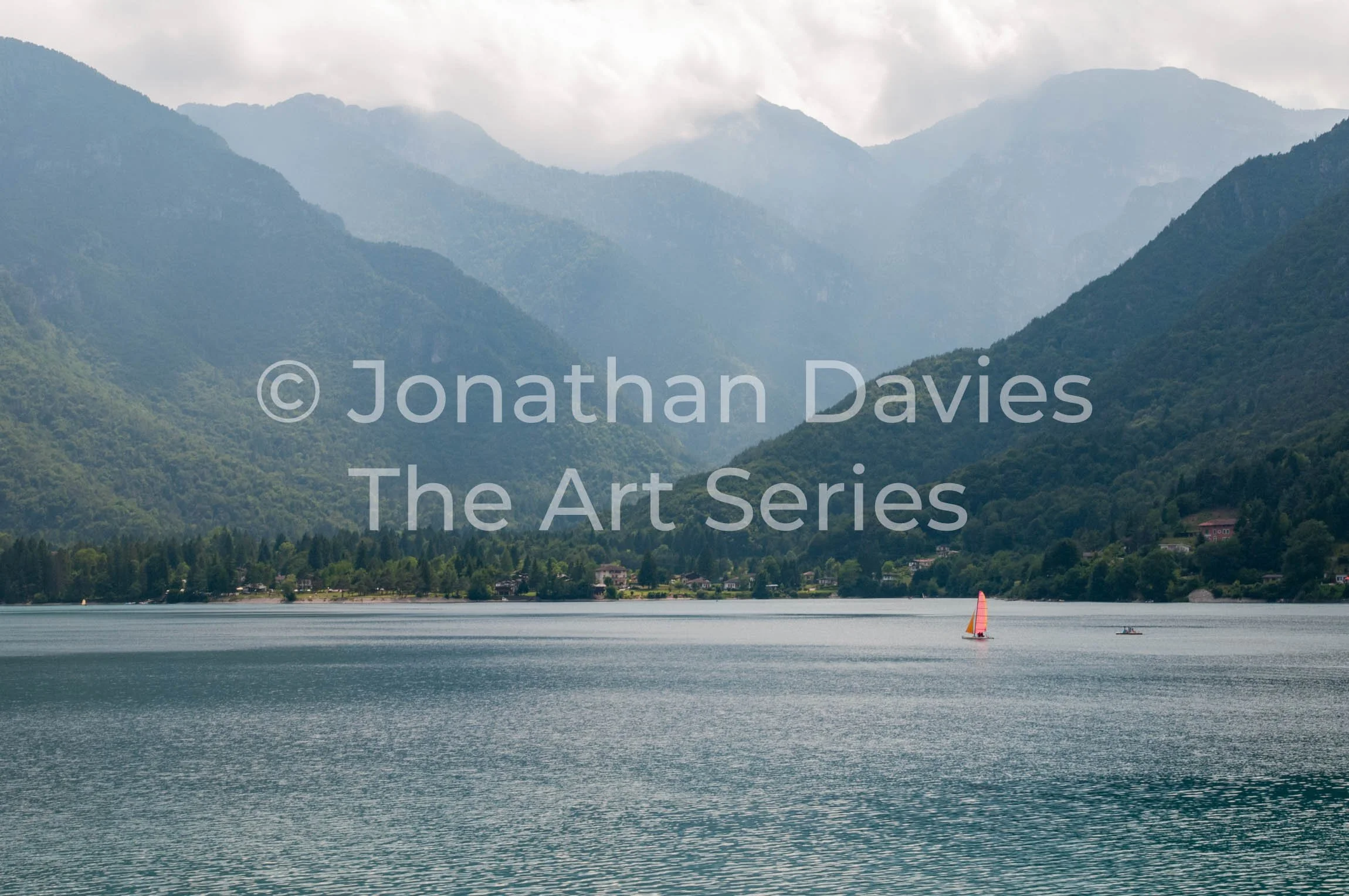 The single sailing boat and the pedalo